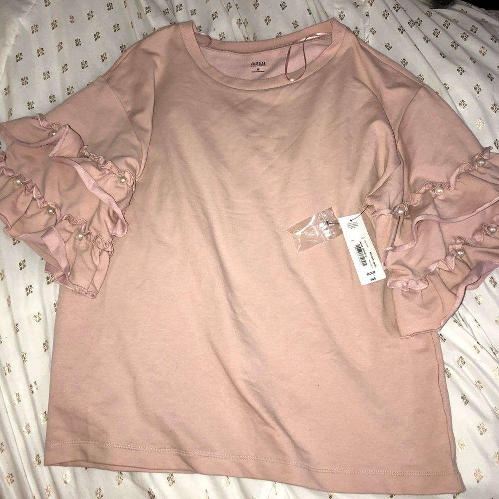 Pink a. n. a shirt with ruffled sleeves and pearls